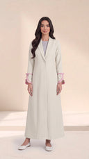 The Hadiya Ruffled Bow Cuff Abaya, in Off White, front view