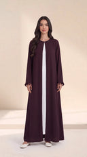 The Zeina Pom-Pom Cuff Abaya, in Dark Purple, front view
