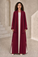 The Fadwa Pearl Bow Slit Abaya, in Burgundy, front view