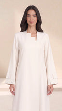The Ghalia Asymmetric Step Neck Abaya, in Off White, front view