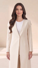 The Nahla Buttoned Shoulder Tab Abaya, in Off White, front view
