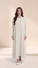 The Nashwa Scalloped Front Edge Abaya, in Off White, front view