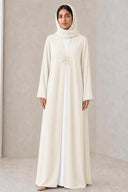 The Reham Floral Embellished Clasp Abaya, in Off White, front view