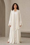 The Sakina Pearl Bow Cuff Abaya, in Off White, front view