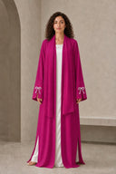 The Sakina Pearl Bow Cuff Abaya, in Pink, front view
