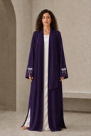 The Sakina Pearl Bow Cuff Abaya, in Dark Purple, front view