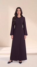 The Samira Curved Asymmetric Button Abaya, in Dark Purple, front view