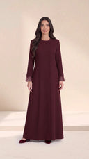 The Sundus Asymmetric Button Abaya, in Burgundy, front view
