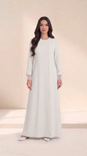 The Sundus Asymmetric Button Abaya, in Off White, front view