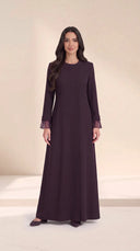 The Sundus Asymmetric Button Abaya, in Dark Purple, front view