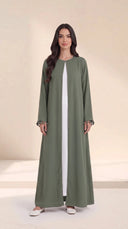 The Zeina Pom-Pom Cuff Abaya, in Green, front view
