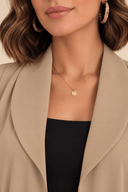 Close-up of The Nadia Signature Soft-Collar Open Abaya styled with a delicate gold necklace, highlighting its soft open neckline.