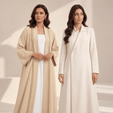 Two models wearing an open beige abaya over a white inner dress and a closed ivory abaya dress, illustrating the difference between abaya styles.