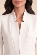 Close-up of The Dariah Tailored Notch Neck Abaya in ivory, highlighting its structured notch neckline and tailored detailing