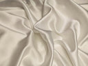 Ivory silk fabric with soft folds and a subtle sheen for silk abayas