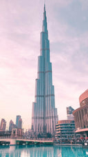 Burj Khalifa overlooking Downtown Dubai and the Dubai Fountain at sunset.