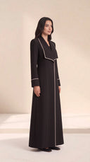 The Nuha Piped Wide Lapel Abaya, in Black, side view