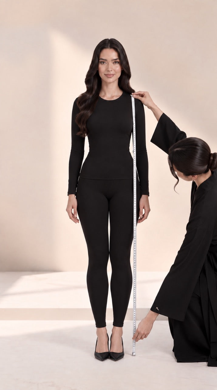 Measuring length from shoulder to hem in heels, with a helper