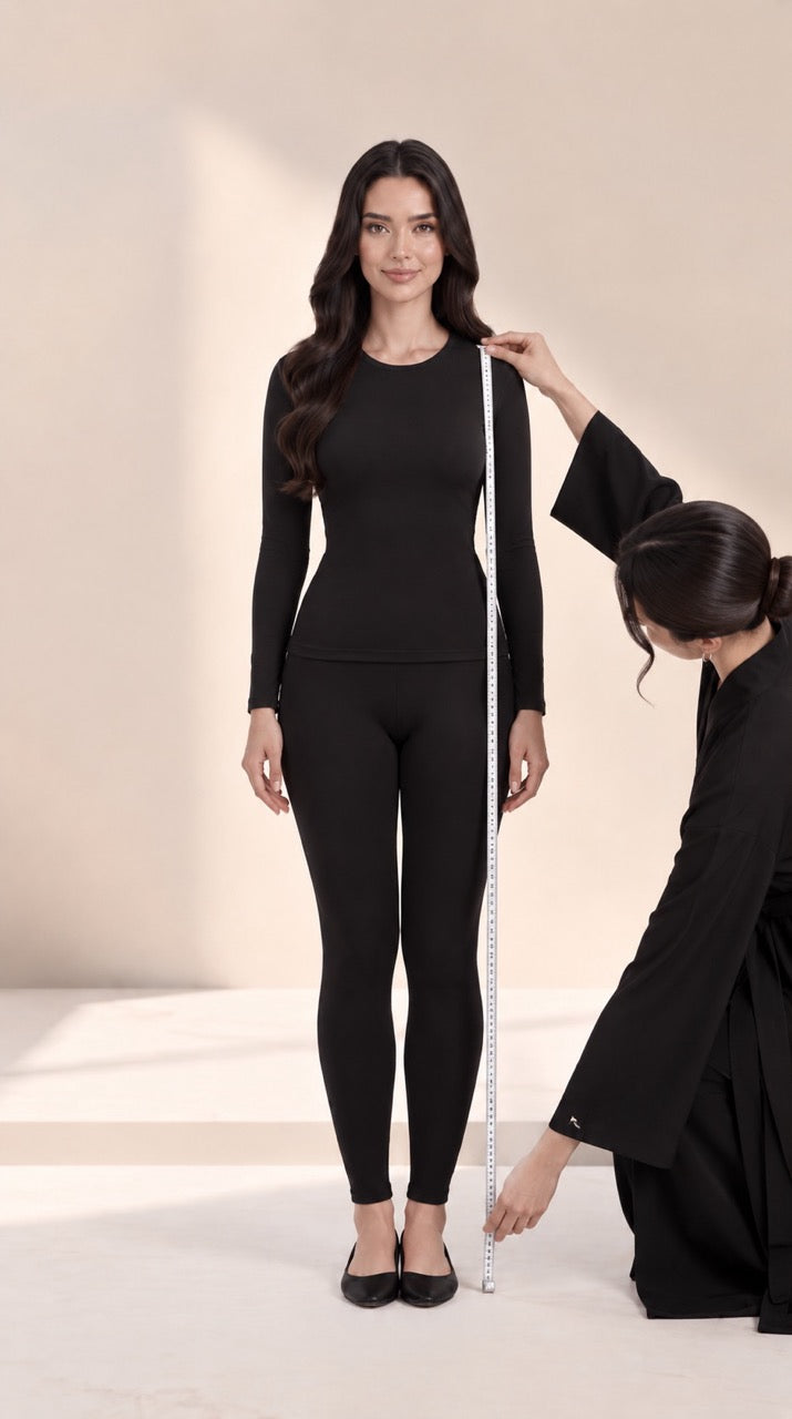 Measuring length from shoulder to hem in flat shoes, with a helper