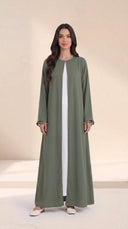 The Zeina Pom-Pom Cuff Abaya, in Green, front view