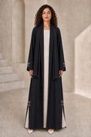 The Fadwa Pearl Bow Slit Abaya, in Black, front view