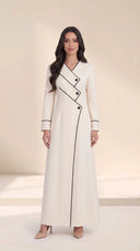 The Roaa Tiered Asymmetric Button Abaya, in Off White, front view