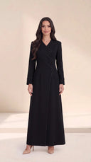 The Roaa Tiered Asymmetric Button Abaya, in Black, front view