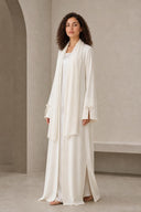 The Sakina Pearl Bow Cuff Abaya, in Off White, side view