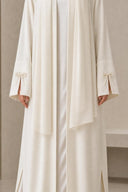 The Sakina Pearl Bow Cuff Abaya, in Off White, detail view