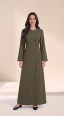 The Samira Curved Asymmetric Button Abaya, in Green, front view