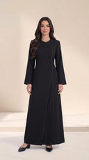 The Samira Curved Asymmetric Button Abaya, in Black, front view