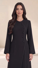 The Samira Curved Asymmetric Button Abaya, in Black, front view