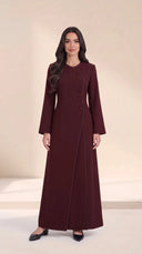 The Samira Curved Asymmetric Button Abaya, in Burgundy, front view
