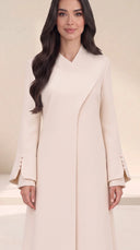 The Sawsan Curved Wrap Collar Abaya, in Off White, front view