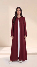 The Zeina Pom-Pom Cuff Abaya, in Burgundy, front view