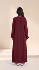 The Zeina Pom-Pom Cuff Abaya, in Burgundy, back view