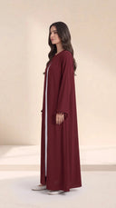 The Zeina Pom-Pom Cuff Abaya, in Burgundy, side view